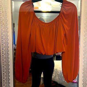 Orange off the shoulder crop